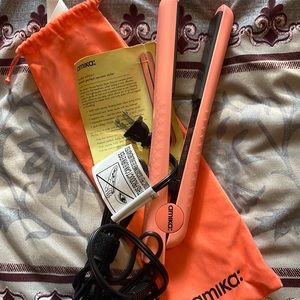 authentic. never used, full sized 1.25in pink flat iron with ceramic